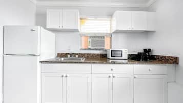 Mini-fridge, microwave, coffee/tea maker, cookware/dishes/utensils