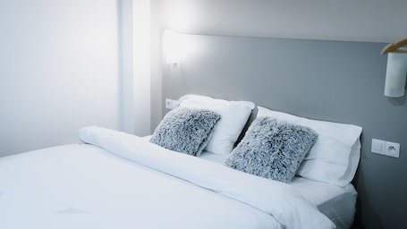 Individually decorated, individually furnished, desk, blackout curtains. Hotel des Arcades