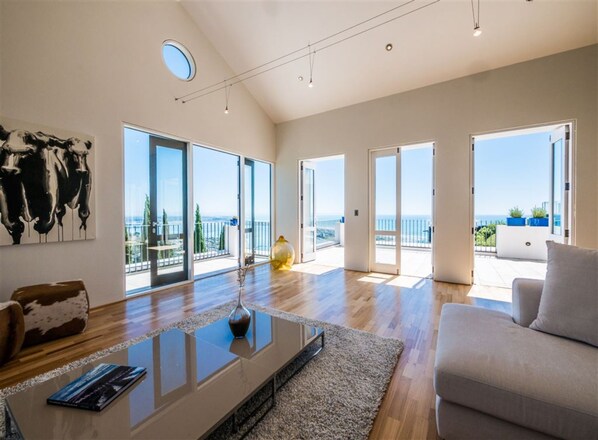 Luxury Villa, Multiple Beds, Ocean View | Living room | Flat-screen TV - Sensation on Revelation (Christchurch)