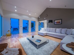 Luxury Villa, Multiple Beds, Ocean View | Living room | Flat-screen TV - Sensation on Revelation (Christchurch)