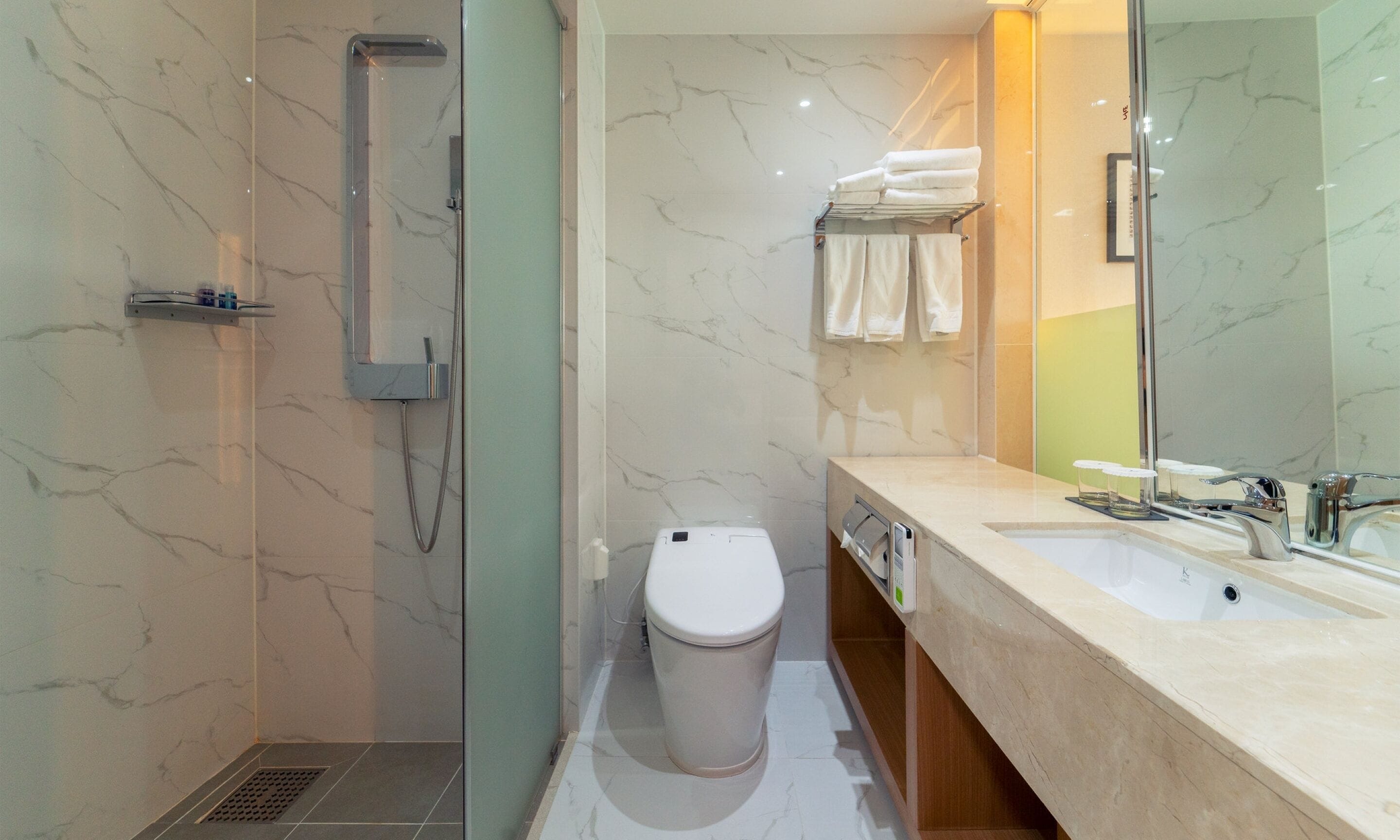 shower, hair dryer, slippers, towels