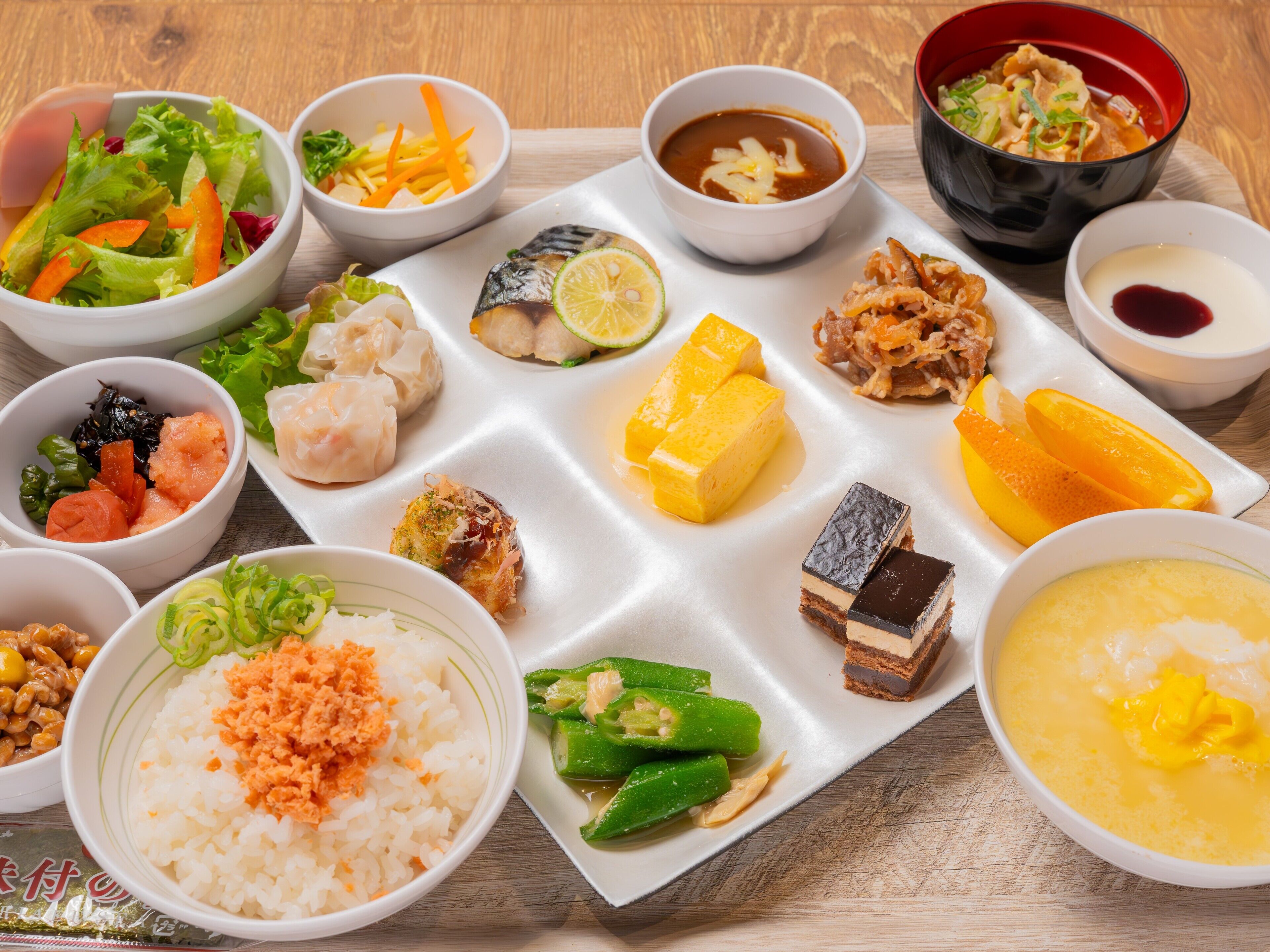 A variety of Japanese dishes arranged on a tray.