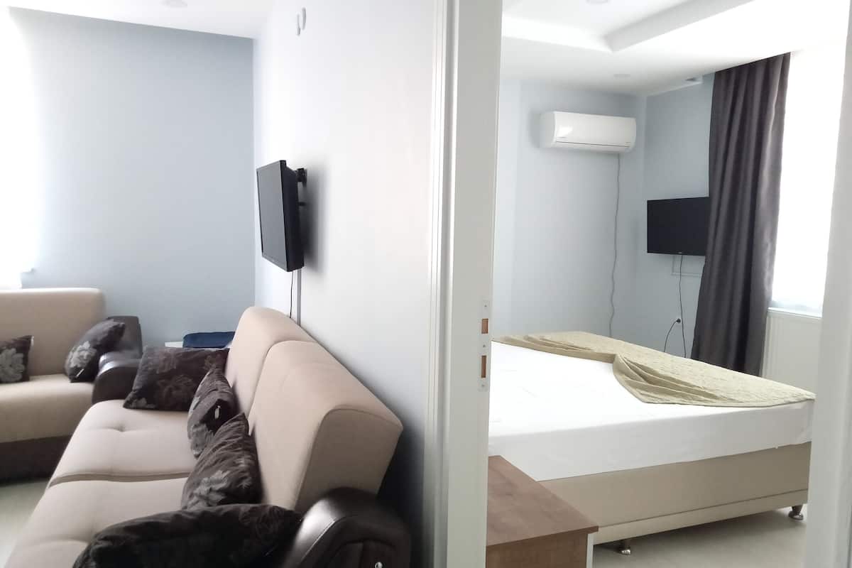 family suite | desk, laptop workspace, blackout curtains, soundproofing