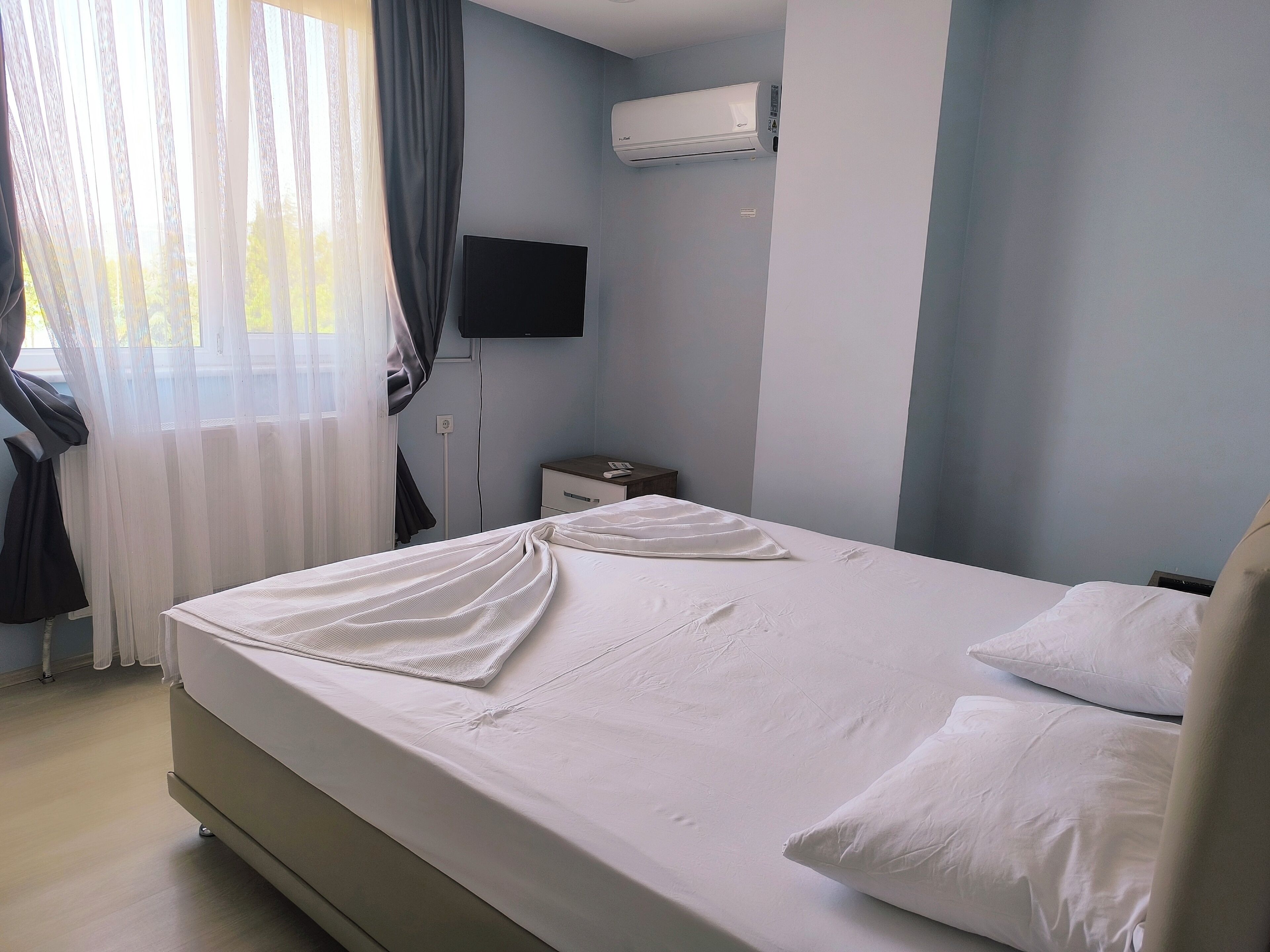 family suite | desk, laptop workspace, blackout curtains, soundproofing