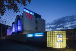 A modern hotel building with a prominent sign reading "HOTEL Oxy". - Hotel OXY - Adults Only (Hidaka)