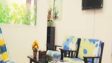 Standard Double Room | Living area | Flat-screen TV