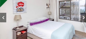 Quarto casal empresarial, 1 quarto, no andar executivo | Cortinas blackout, ferros/tábuas de passar roupa, Wi-Fi de cortesia