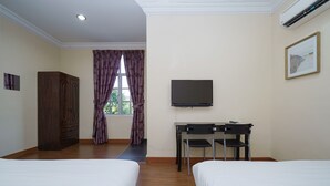A hotel room with two beds, a desk with a chair, a TV, a wardrobe, and a window with curtains. - Hotel O Bangi Sri Minang Guesthouse (Bandar Baru Bangi)