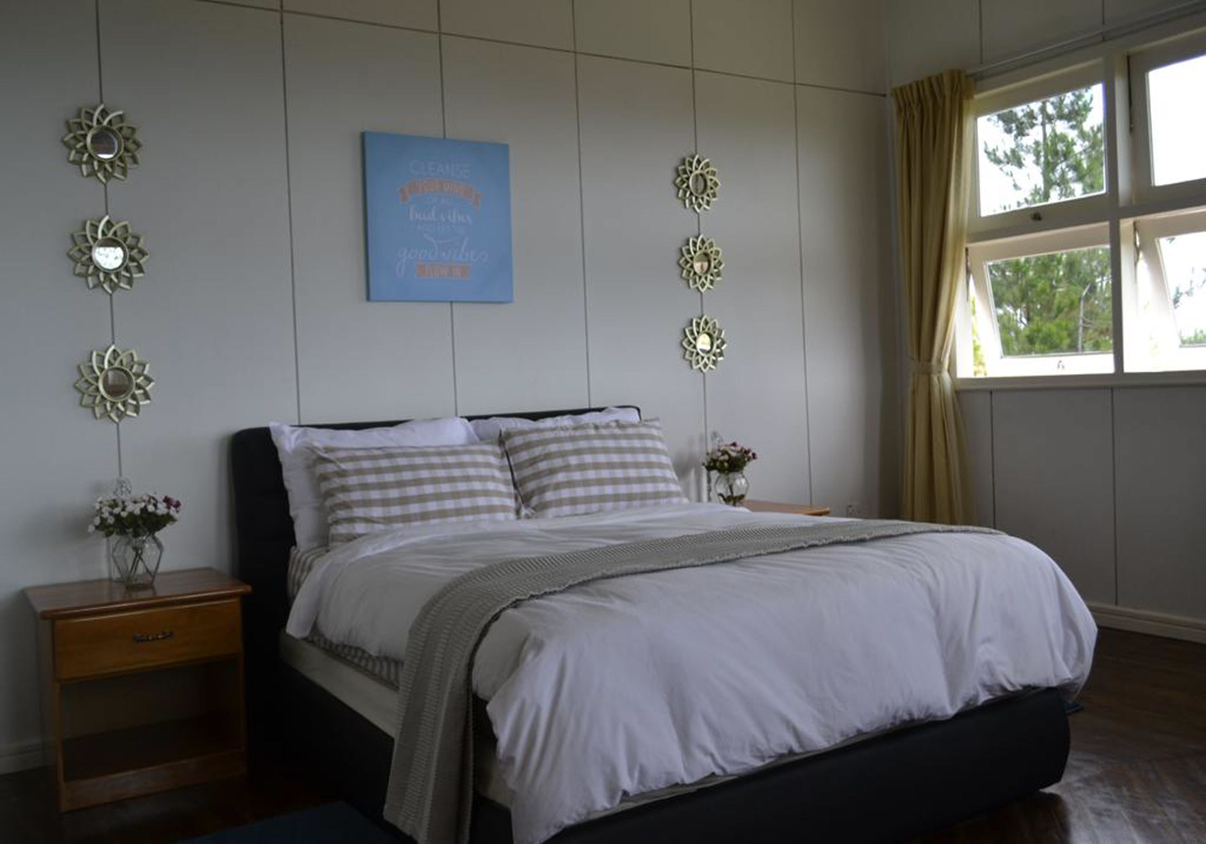 Desk, iron/ironing board, bed sheets