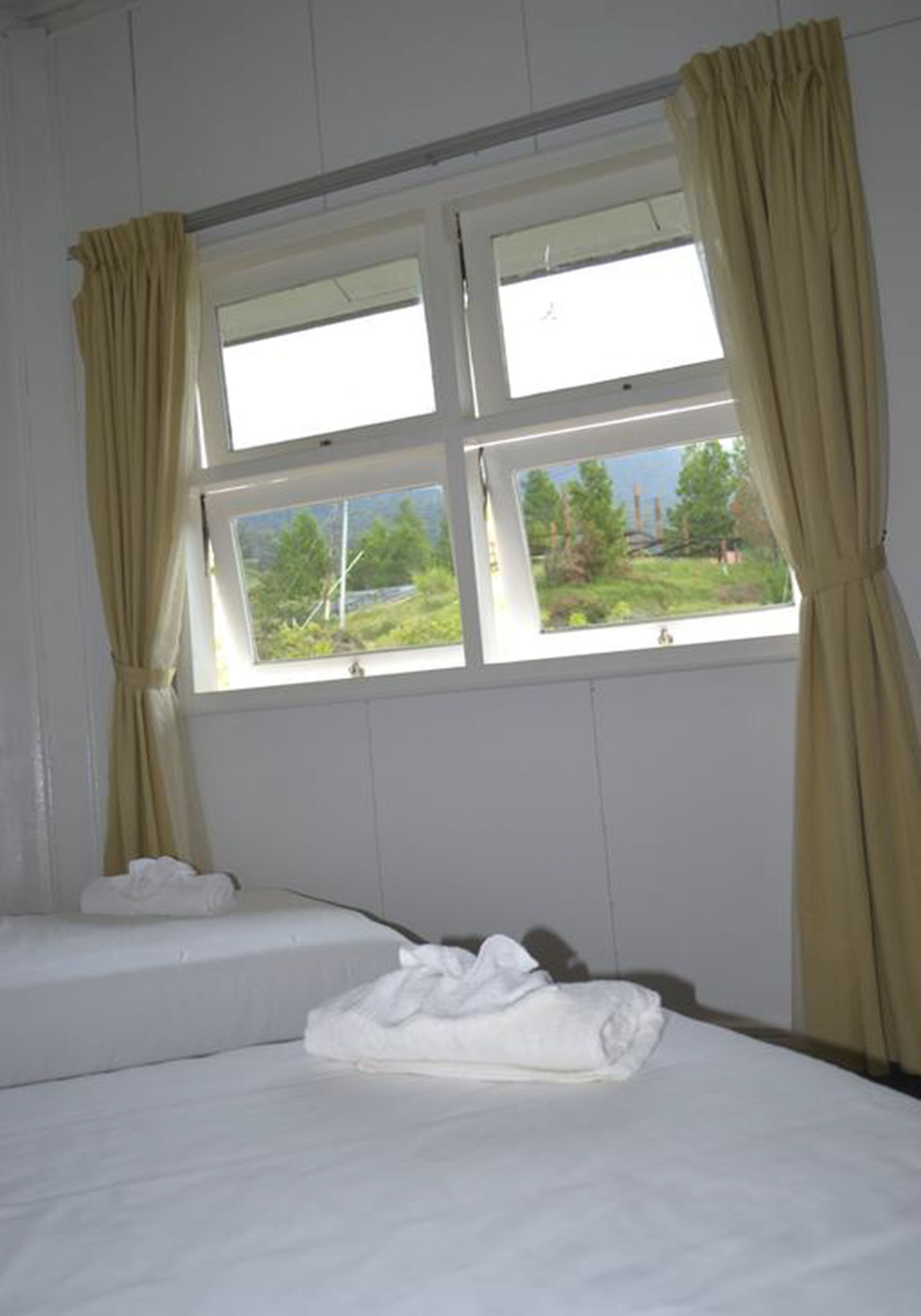 Desk, iron/ironing board, bed sheets