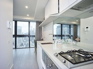 Apartment, 1 Bedroom | Private kitchen | Full-size fridge, microwave, oven, stovetop - Elegant High Rise Apartment with an Unforgettable View (Melbourne)