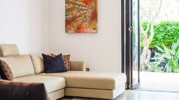 Apartment, 3 Bedrooms | Living area | Flat-screen TV