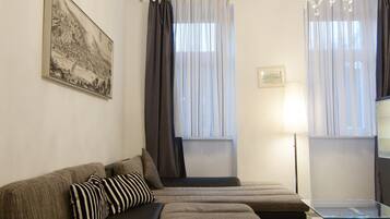 Apartment, 1 Bedroom | Living room | Flat-screen TV