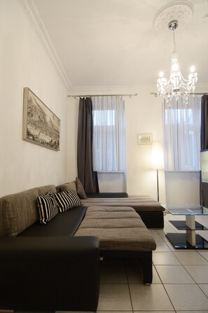 Apartment, 1 Bedroom | Living room | Flat-screen TV