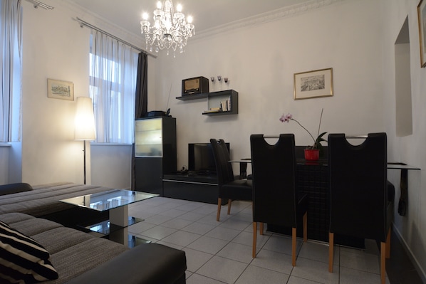 Apartment, 1 Bedroom | Living room | Flat-screen TV