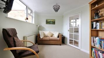 Premium Apartment, 1 Double Bed | Living room | 23-inch flat-screen TV with digital channels, TV, DVD player