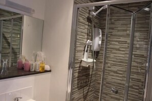 Shower, free toiletries, hair dryer, towels