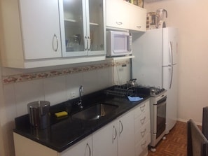 Cottage | Private kitchenette | Fridge, microwave, oven, cookware/dishes/utensils