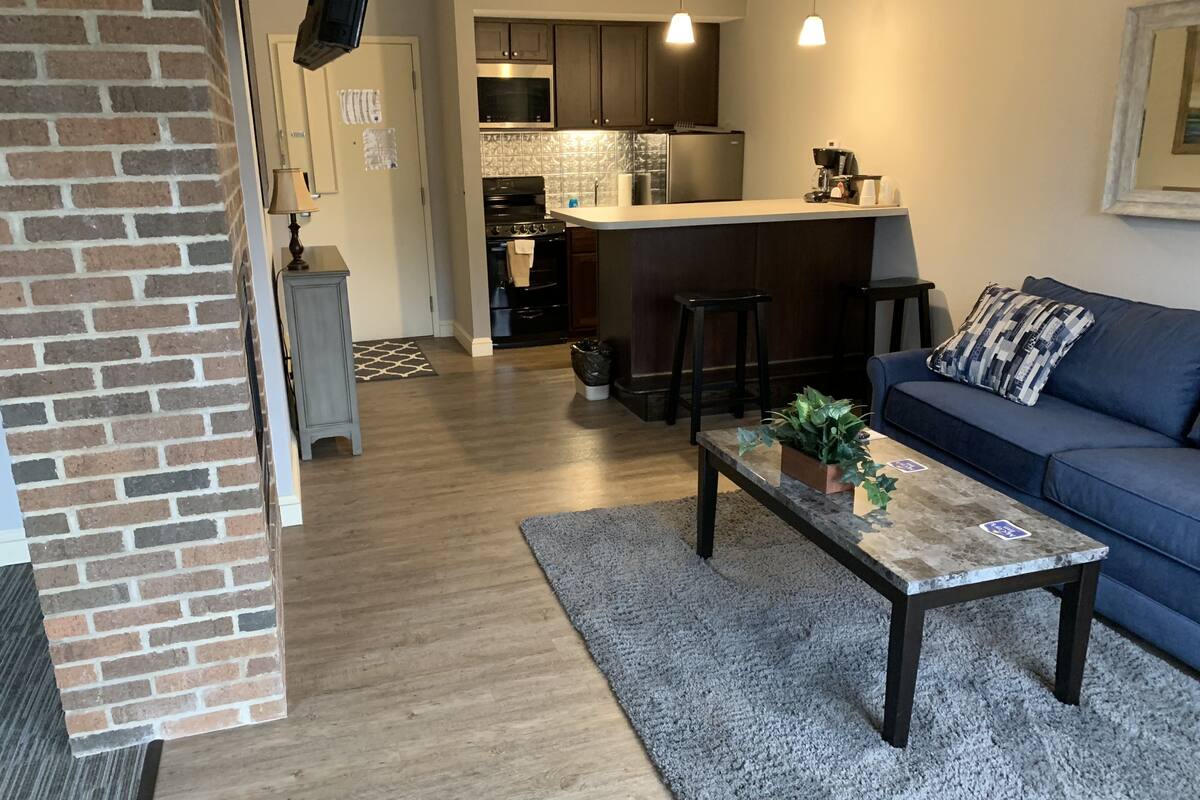 exclusive suite, multiple beds, fireplace | living area | 55-inch smart tv with cable channels, tv