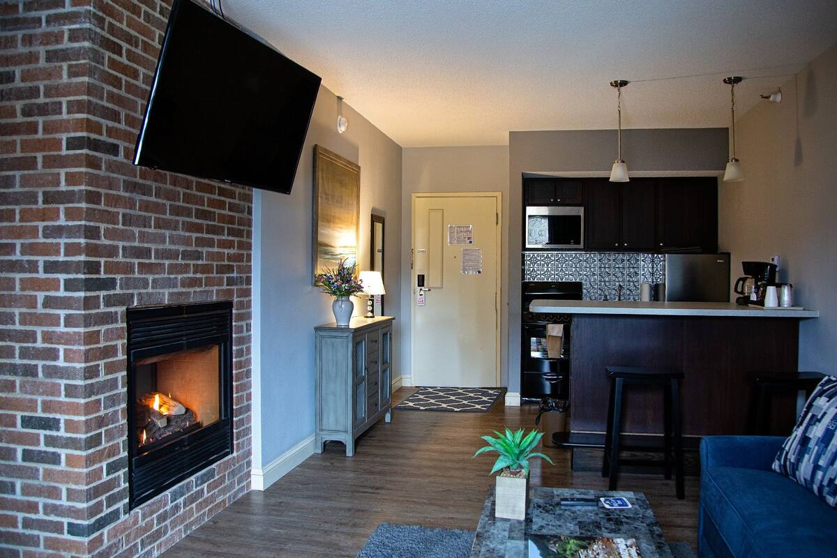 exclusive suite, multiple beds, fireplace | 1 bedroom, premium bedding, blackout curtains, iron/ironing board