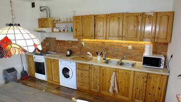 Fridge, microwave, cookware/dishes/utensils