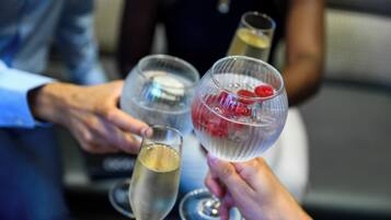 A group of people holding champagne glasses.