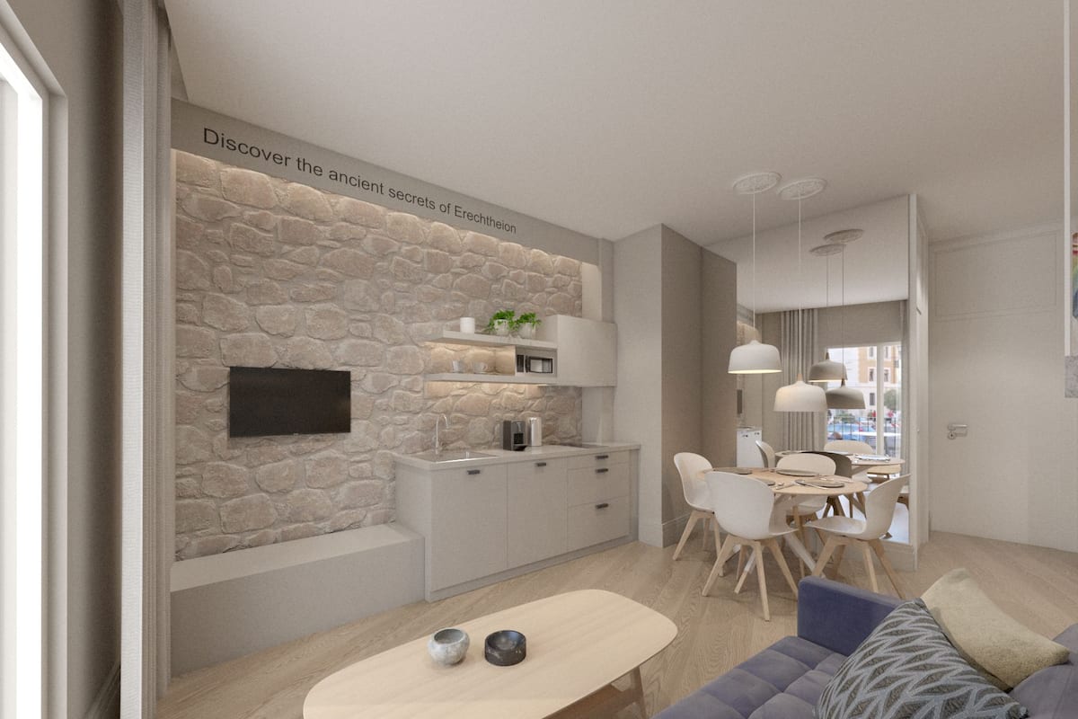 A modern living room with a stone wall, a flat-screen TV, a dining area with a table and chairs, and a sofa with cushions.