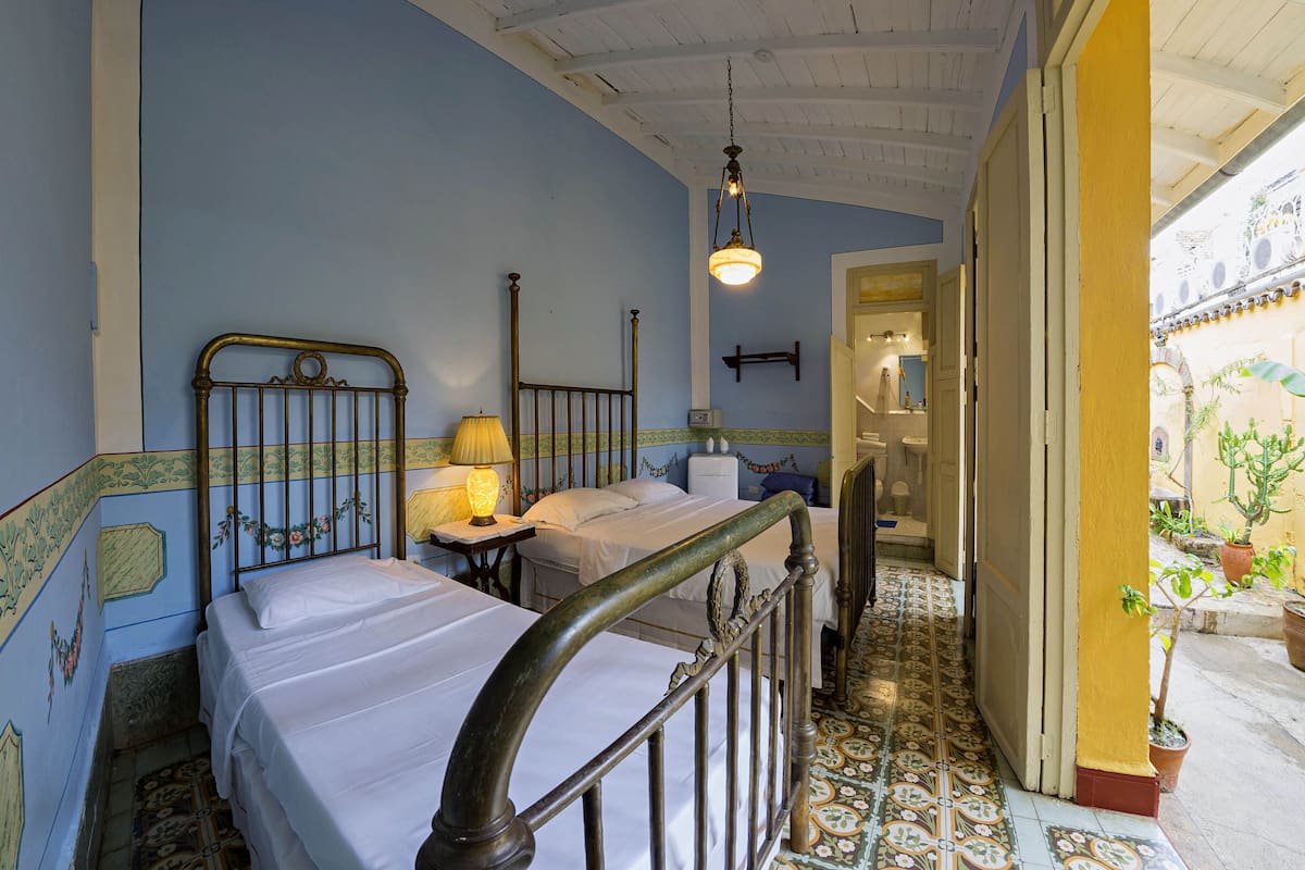 classic triple room, multiple beds | 1 bedroom, minibar, in-room safe, individually decorated