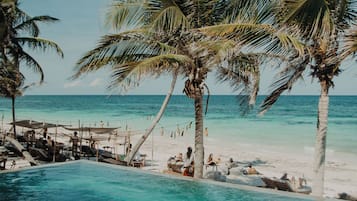 Outdoor pool, open 8:00 AM to 8:00 PM, pool loungers