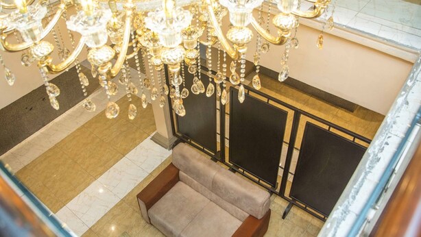 A spacious lobby with a high ceiling and ornate chandeliers. - Royal Crest Hotel & Suites (Port Harcourt)