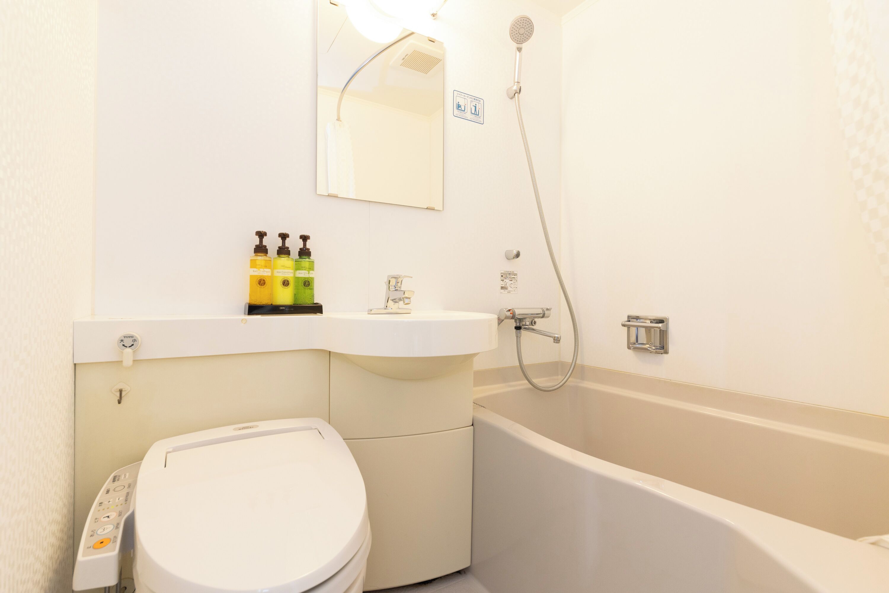 combined shower/bathtub, free toiletries, hair dryer, slippers