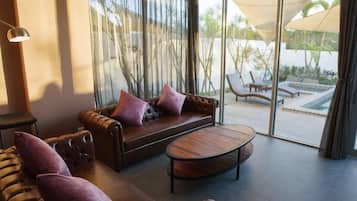 Family House, 2 Bedrooms, Private Pool, Courtyard Area | Living area | 58-inch LED TV with cable channels, TV