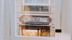 A storefront with a sign that reads "CAMICERIA" and "R. BALDUSCHT". - Albergo delle Regioni (Rome)