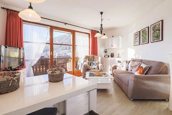 Apartment, Sauna | Living room | Flat-screen TV