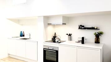 Luxury Apartment, Non Smoking | Private kitchen | Full-size fridge, oven, stovetop, dishwasher