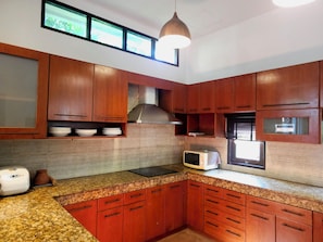 Full-sized fridge, microwave, stovetop, electric kettle