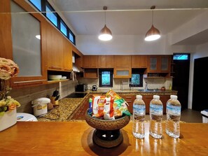 Full-sized fridge, microwave, stovetop, electric kettle