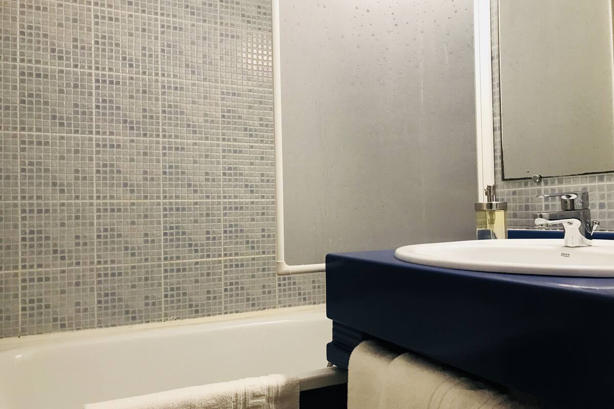 bathtub, free toiletries, hair dryer, towels