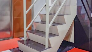 A staircase with a handrail, a smoke detector, and a no smoking sign. - OYO 117 Blueberry Homestay (Jakarta)