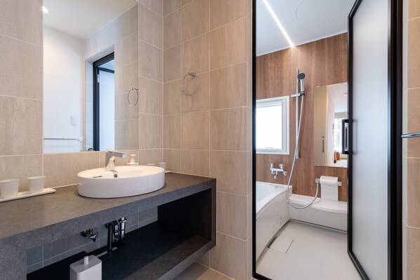 Apartment, 2 Bedrooms | Bathroom | Shower, free toiletries, hair dryer, slippers