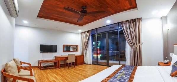 Minibar, desk, blackout curtains, iron/ironing board
