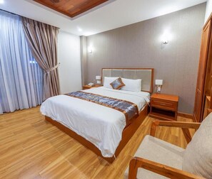 Minibar, desk, blackout curtains, iron/ironing board