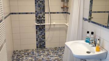 Apartment, Accessible (West) | Bathroom | Shower, free toiletries, hair dryer, towels