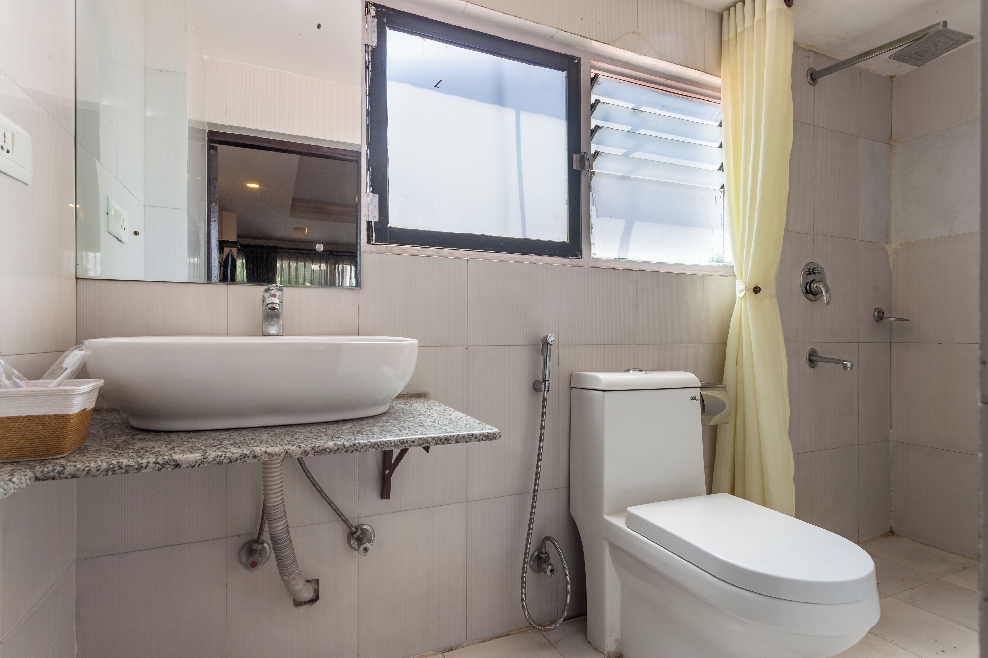deluxe twin room | bathroom | shower, rainfall showerhead, free toiletries, hair dryer