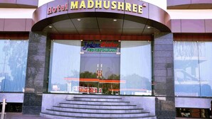 Hotel Madhushree with a visible entrance and a Zodiac Bistro sign.
