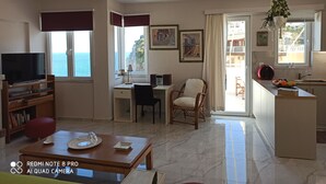 Duplex (Dimi) | Living area | Flat-screen TV, fireplace - Experience & Enjoy Sea View Maisonettes (Malevizi)