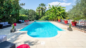 Seasonal outdoor pool, open 7 AM to 9 PM, pool loungers