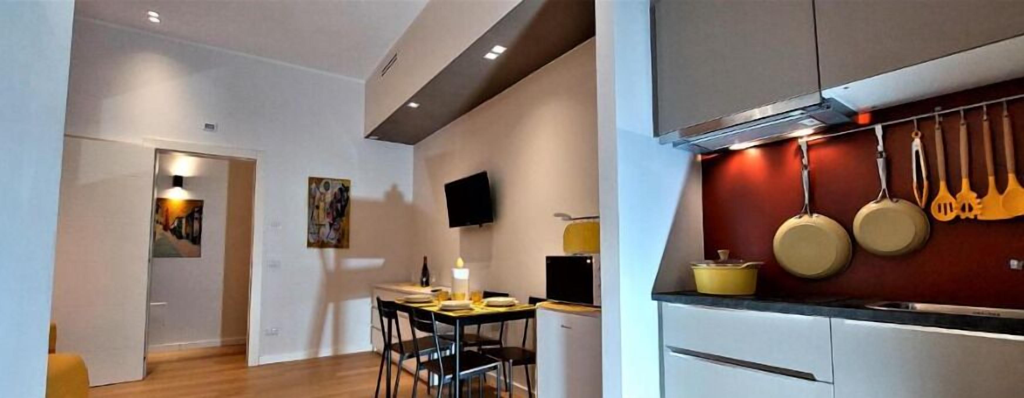 Family Apartment, Courtyard View | Desk, laptop workspace, soundproofing, iron/ironing board