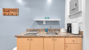 4 - Queen Suite w/Kitchenette | Private kitchen | Fridge, microwave, coffee/tea maker, cookware/dishes/utensils