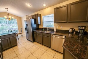 Apartment | Private kitchen | Full-sized fridge, microwave, oven, stovetop - Mallory Pad Apartment 4 Bedroom (Haines City)